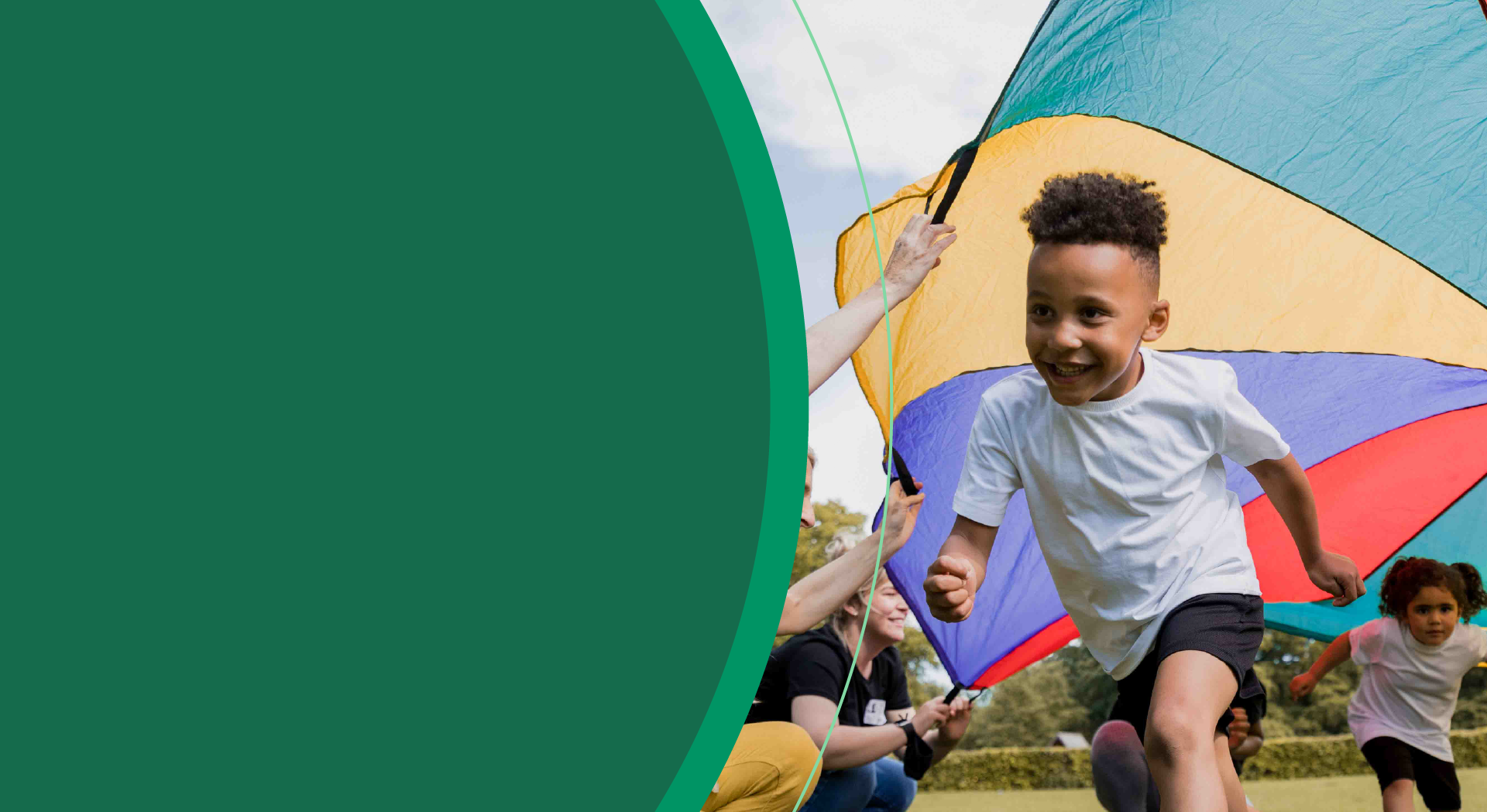 boy running under parachute