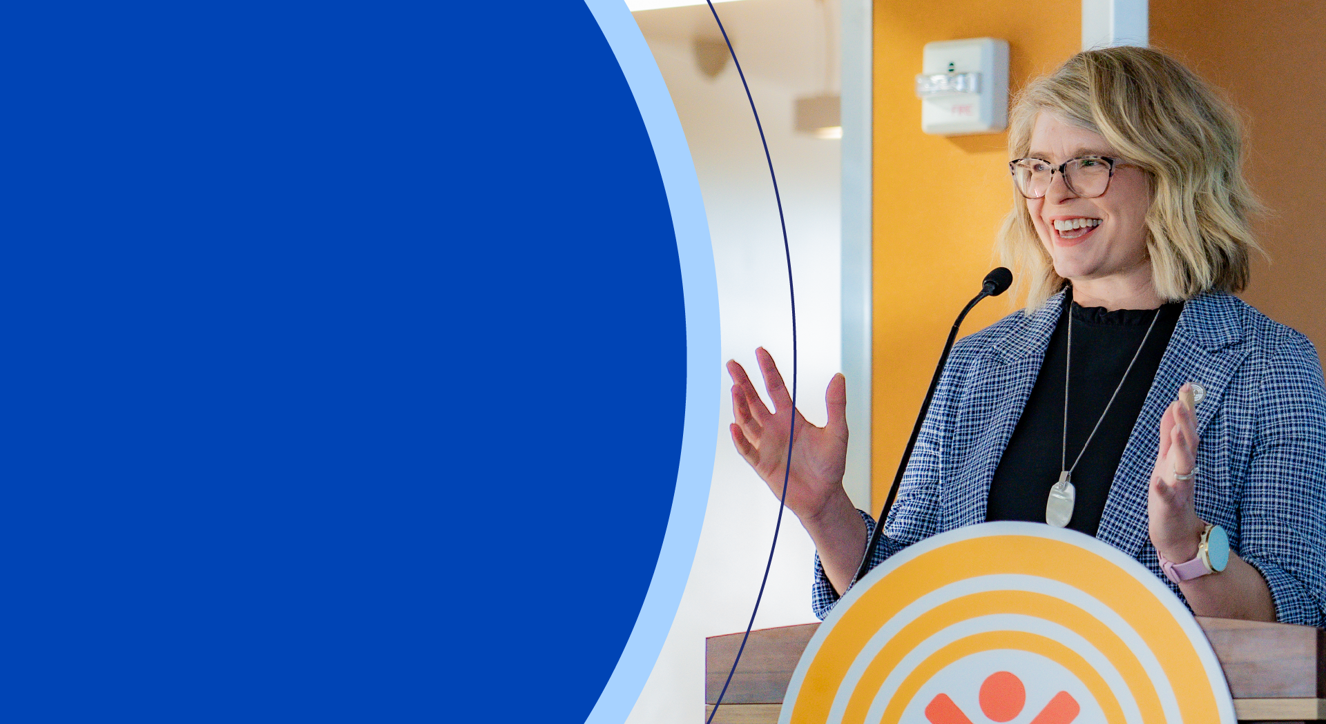 women standing in front of a podium